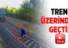 Tren raylarına yattı, tren üzerinden geçti